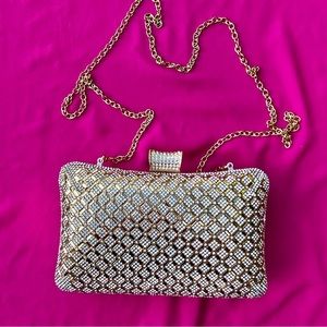 Luxury gold color clutch with detachable gold chain strap.Excellent condition.